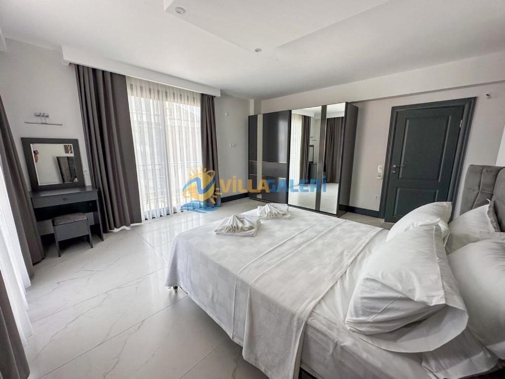 Postel nebo postele na pokoji v ubytování Galaxy Villas in Fethiye