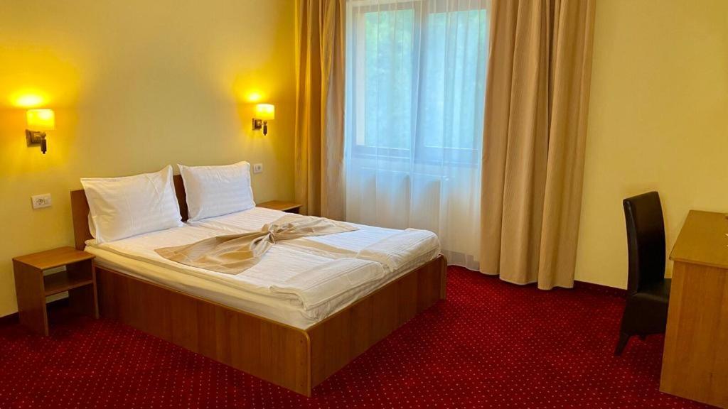 Postel nebo postele na pokoji v ubytování Hotel Termal