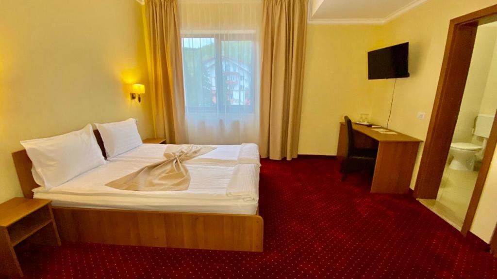 Postel nebo postele na pokoji v ubytování Hotel Termal