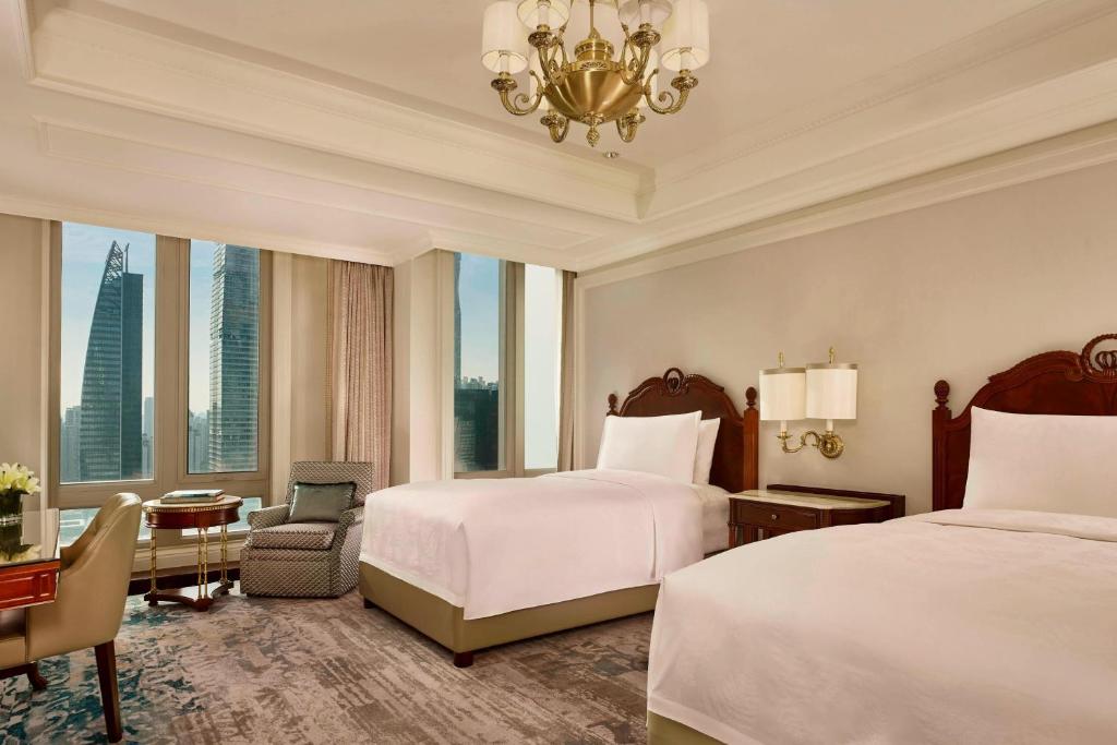 Postel nebo postele na pokoji v ubytování The Ritz-Carlton, Guangzhou