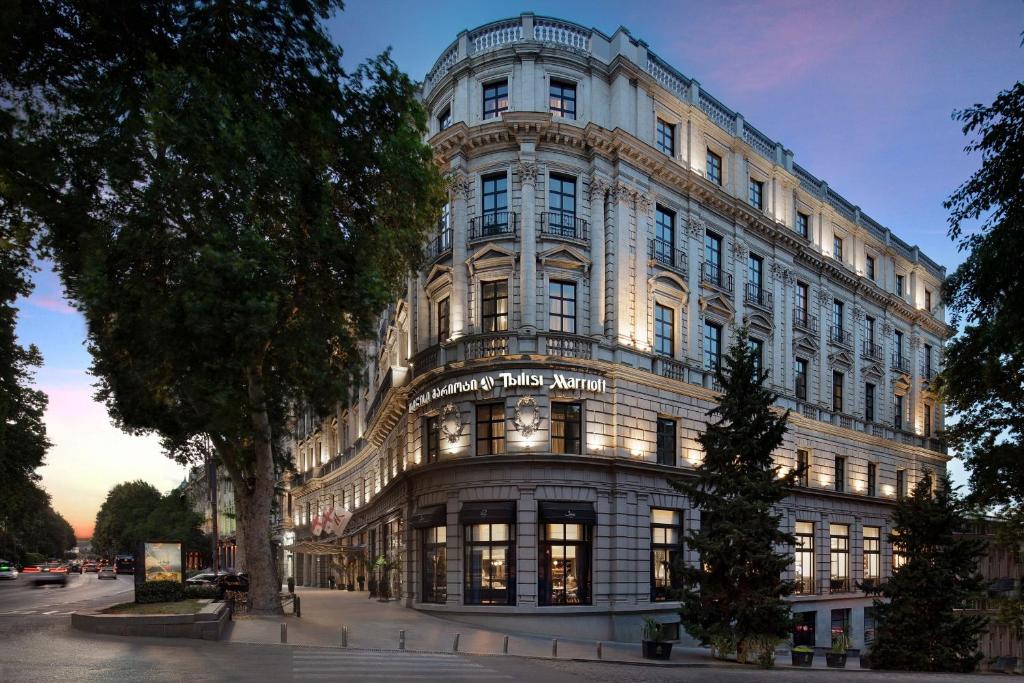 a large building with a sign on the front of it at Tbilisi Marriott Hotel in Tbilisi City