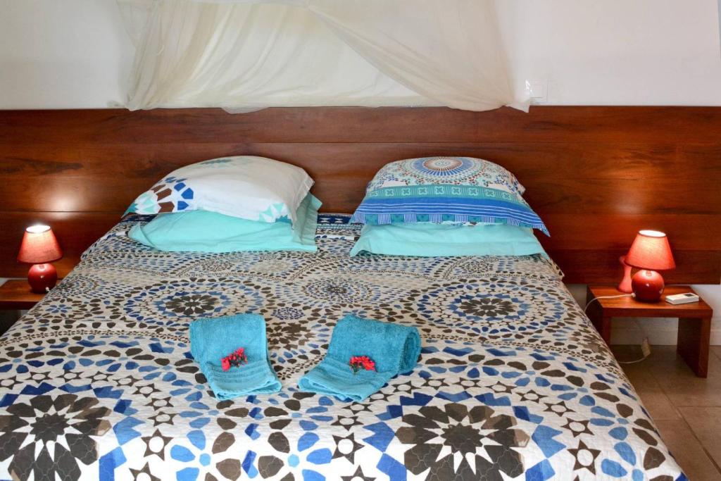 Voodi või voodid majutusasutuse Vue Turquoise Parasol toas