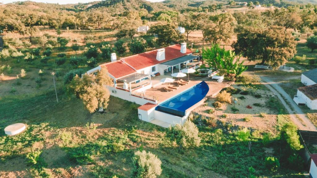 an aerial view of a house with a swimming pool at The Blue House Valley in Grândola