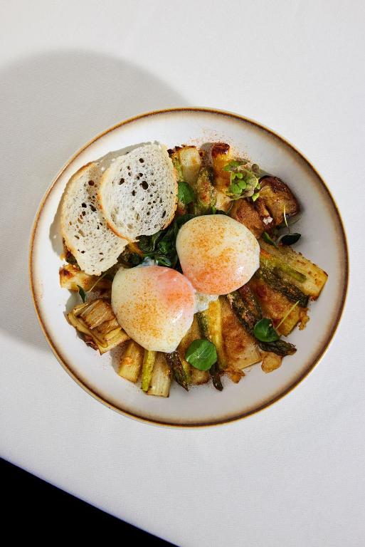 a plate of food with eggs on top at Château Gütsch in Luzern