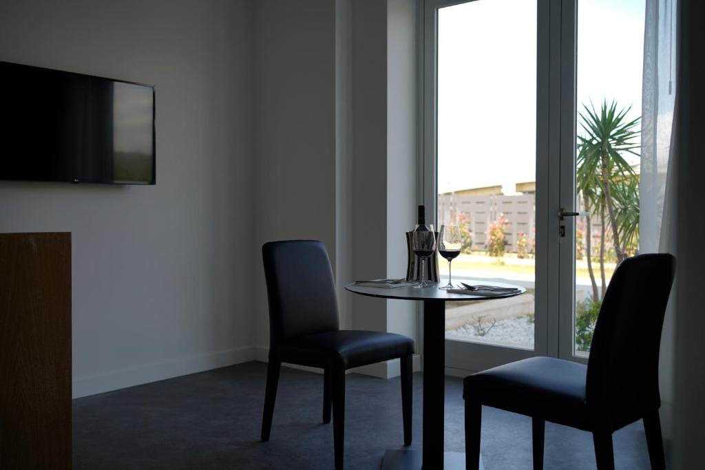 Televízia a/alebo spoločenská miestnosť v ubytovaní PM Hotel
