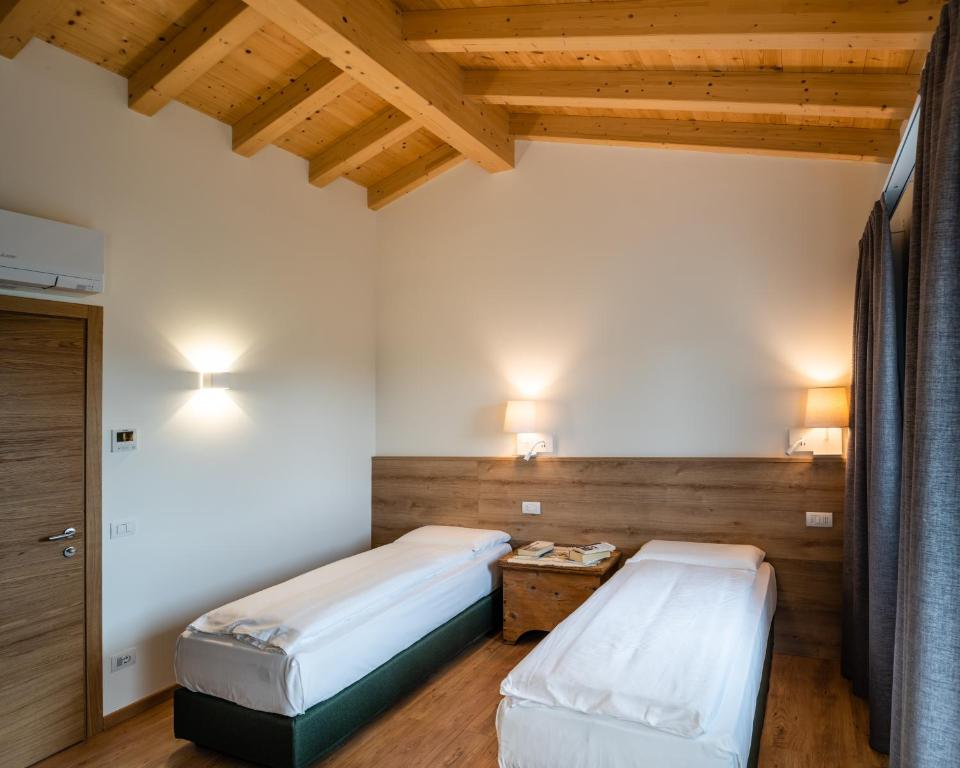 Ein Bett oder Betten in einem Zimmer der Unterkunft Agriturismo al Comarel