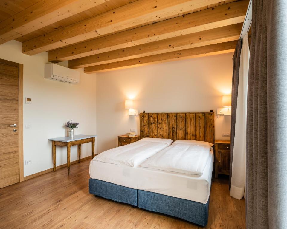 Ein Bett oder Betten in einem Zimmer der Unterkunft Agriturismo al Comarel