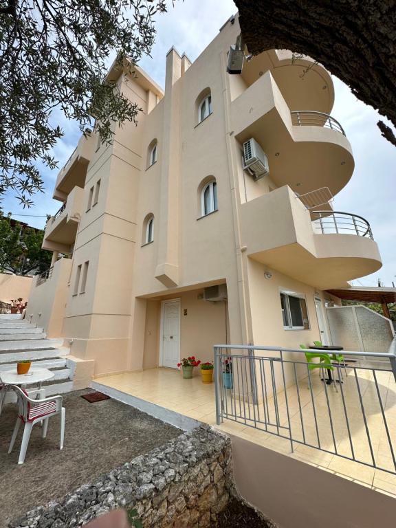 a building with balconies on the side of it at Anna House Dhermi in Dhërmi