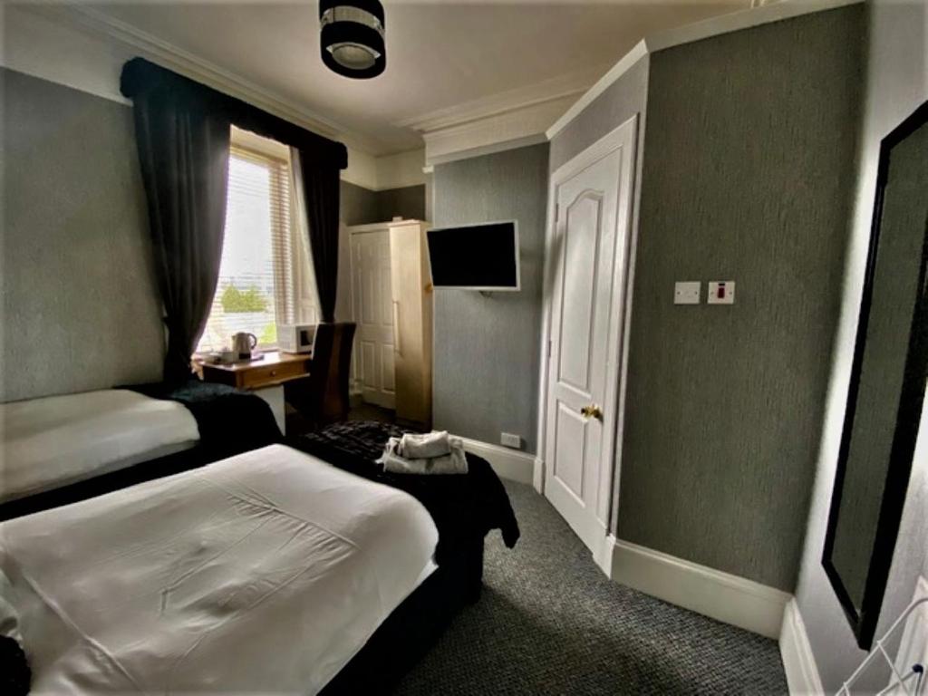 Postel nebo postele na pokoji v ubytování Vaila Guest House