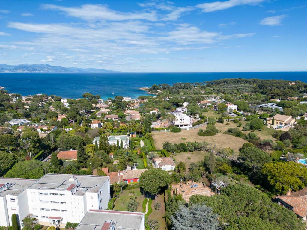an aerial view of a town with the ocean at Hôtel Beau Site - Cap d'Antibes in Antibes