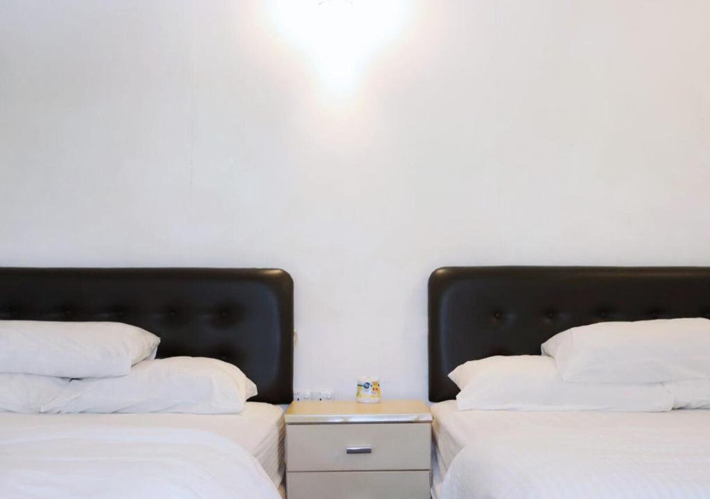 Voodi või voodid majutusasutuse Time Capsule Retreat, Sungai Lembing toas