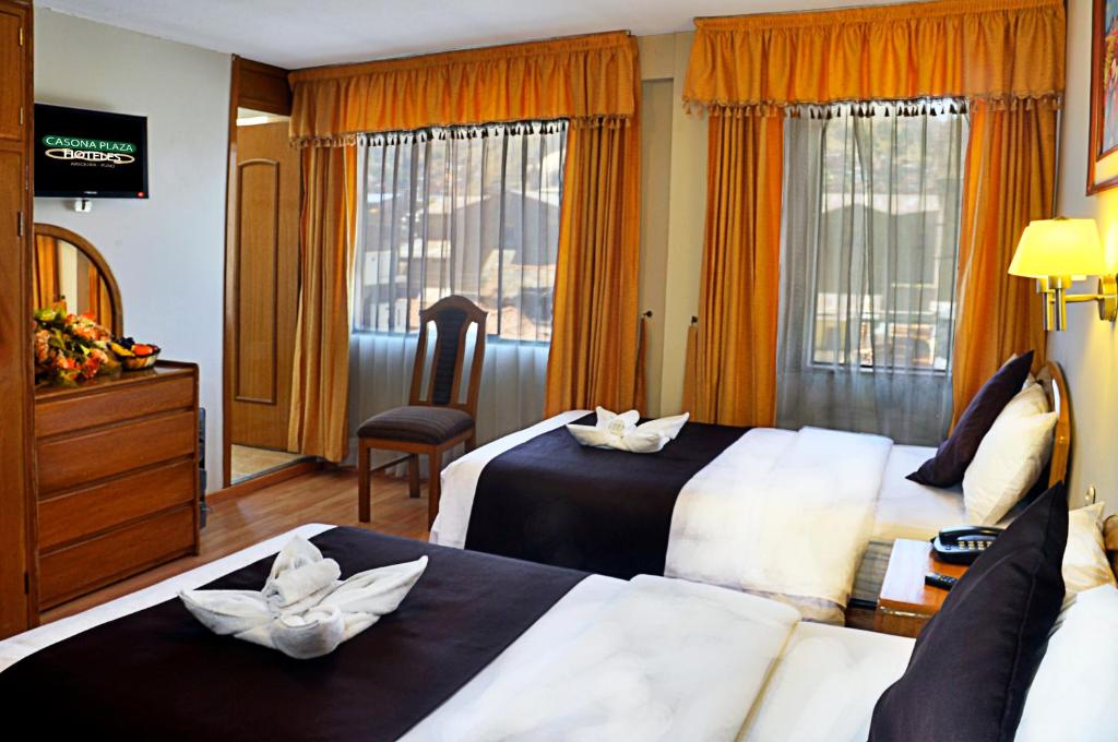 Postel nebo postele na pokoji v ubytování Casona Plaza Balsa Inn