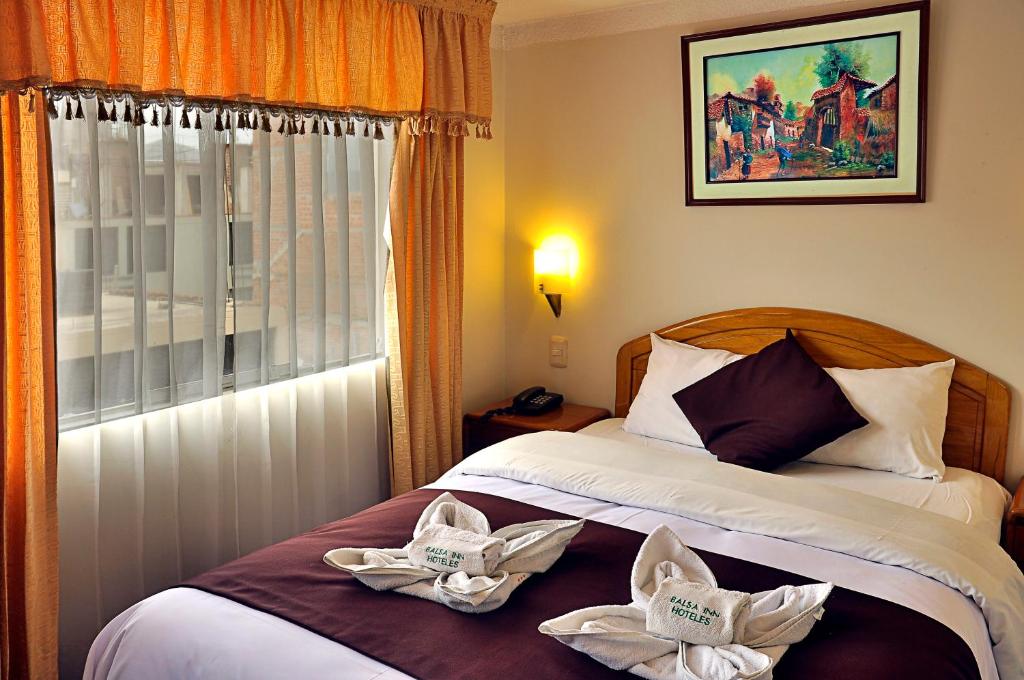 Postel nebo postele na pokoji v ubytování Casona Plaza Balsa Inn