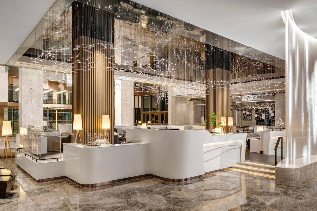 a lobby of a hotel with a reception desk at Kaohsiung Marriott Hotel in Kaohsiung