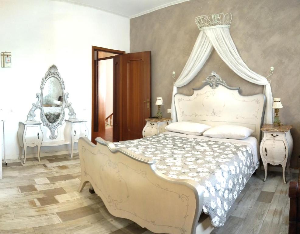 Posteľ alebo postele v izbe v ubytovaní VILLA MOLINELLA