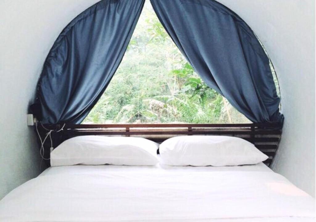 Voodi või voodid majutusasutuse Time Capsule Retreat, Sungai Lembing toas