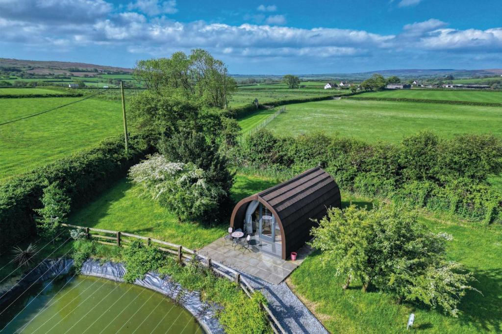 an overhead view of a small house in a field at Ocean View 6 - 1 Bed Large Bridal - Llanrhidian in Llanrhidian