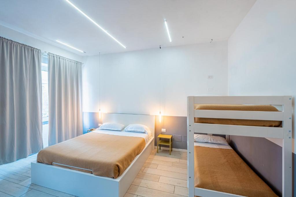 a bedroom with two bunk beds and a window at My Tiny Home in Rome