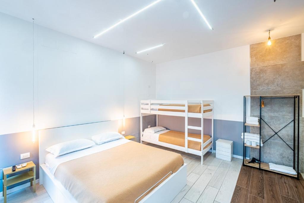 a bedroom with a bed and a bunk bed at My Tiny Home in Rome