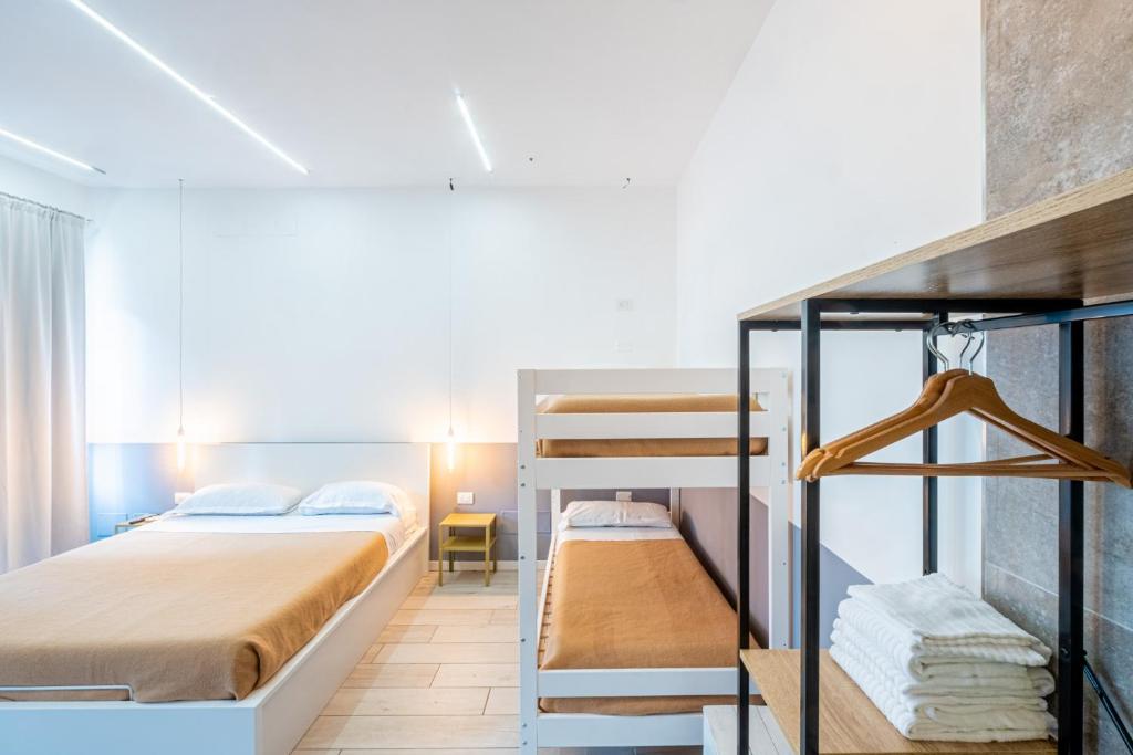 a room with two bunk beds and a staircase at My Tiny Home in Rome