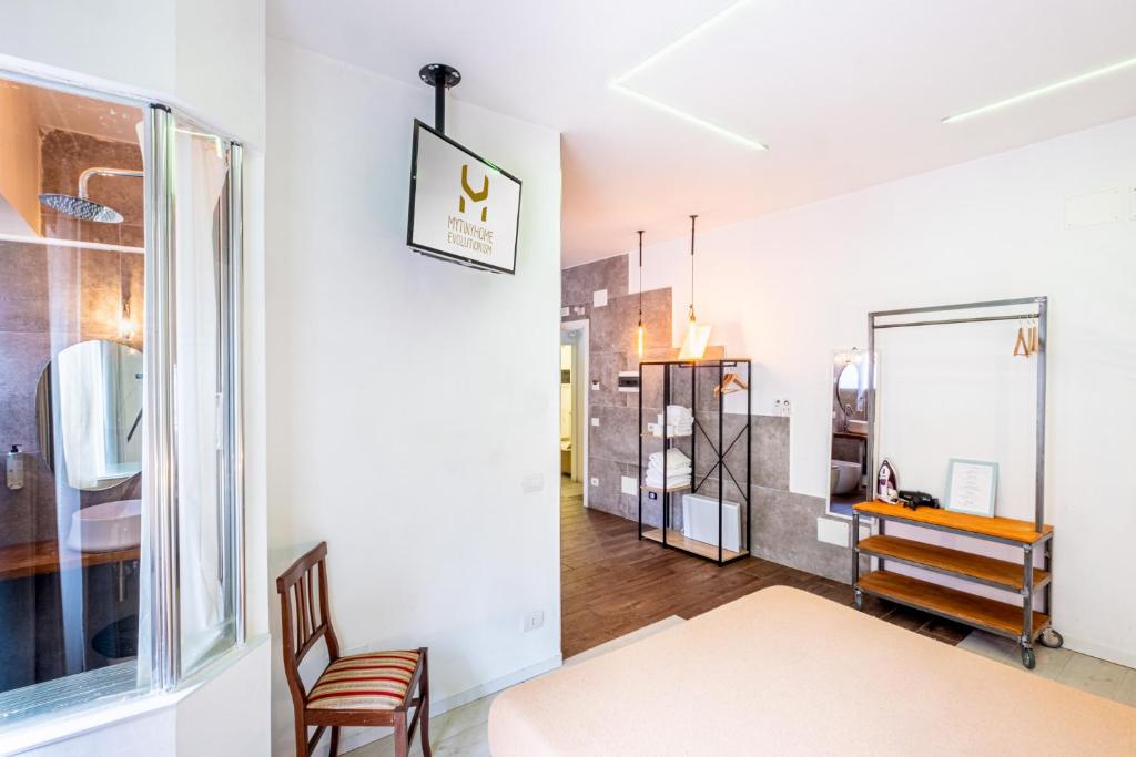 a room with a table and a chair and a window at My Tiny Home in Rome