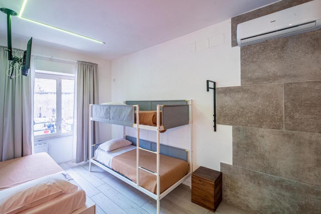 a bedroom with two bunk beds and a window at My Tiny Home in Rome
