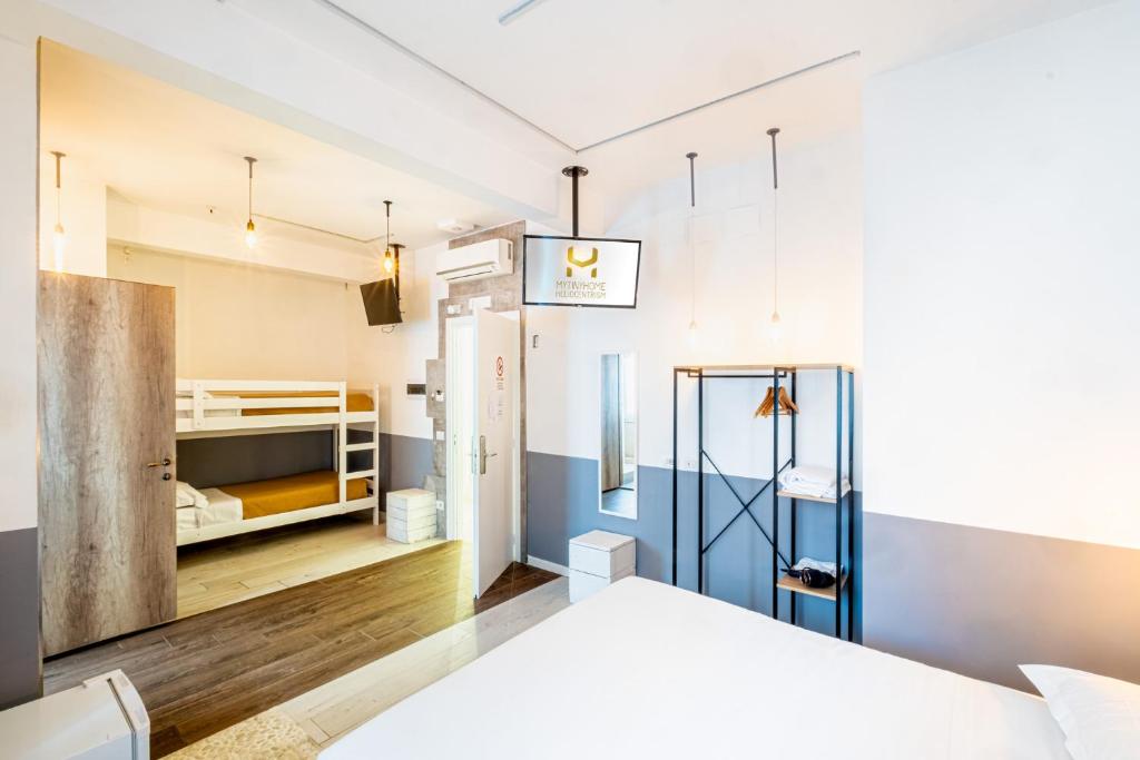 a bedroom with blue and white walls and a bed at My Tiny Home in Rome