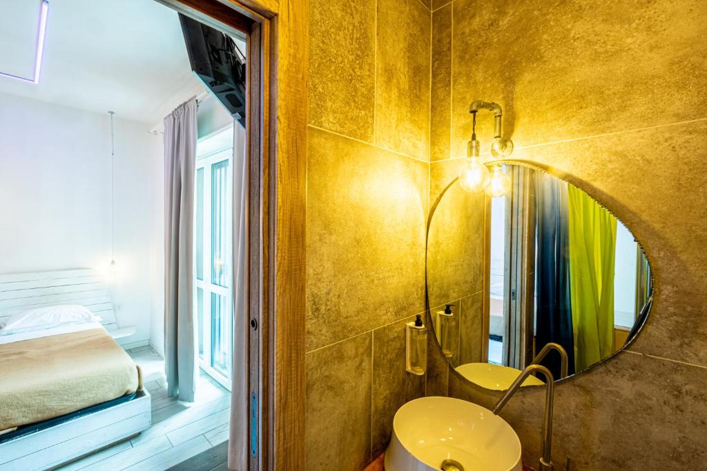 a bathroom with a sink and a mirror at My Tiny Home in Rome