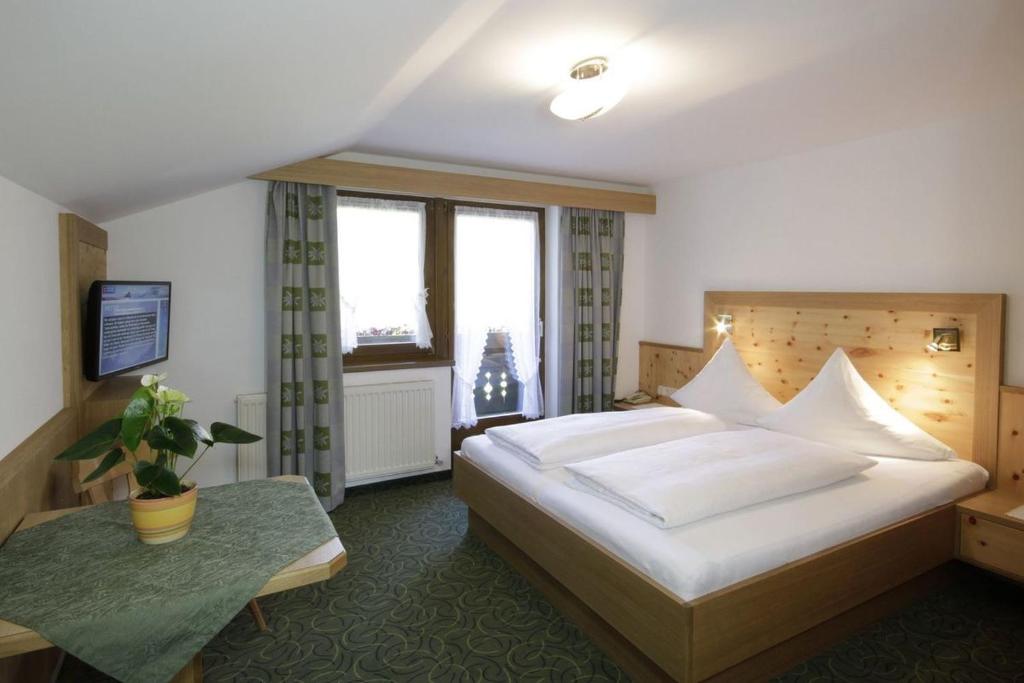 Кровать или кровати в номере Pension Wendlhof