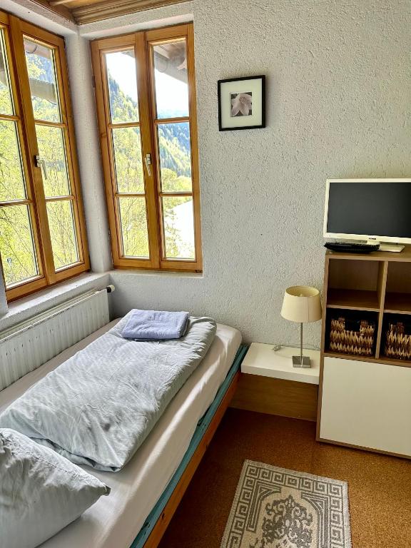 Postel nebo postele na pokoji v ubytování Pension Steakhaus Füssen
