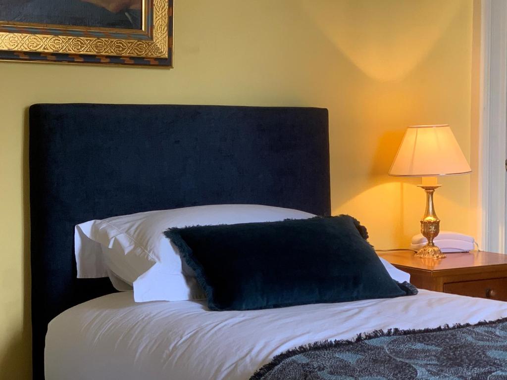 Postel nebo postele na pokoji v ubytování Château Maucaillou