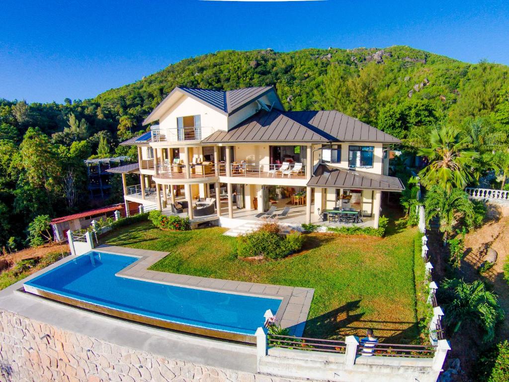 an aerial view of a house with a swimming pool at La Vue in Beau Vallon