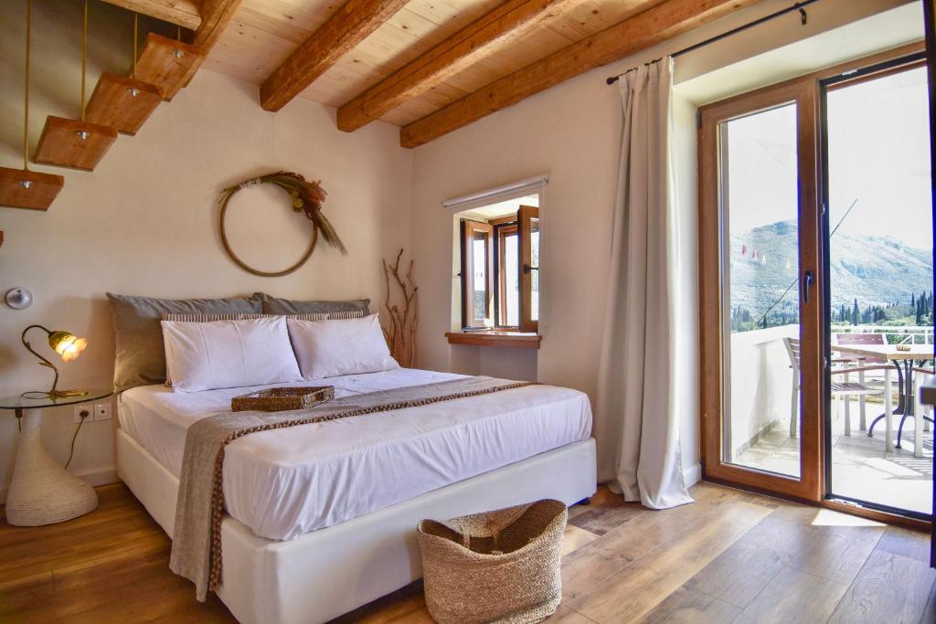 Postel nebo postele na pokoji v ubytování Kidoni cottage