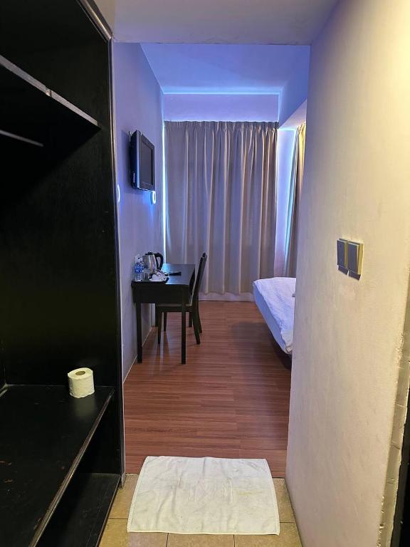 Postel nebo postele na pokoji v ubytování De Choice Hotel Tawau