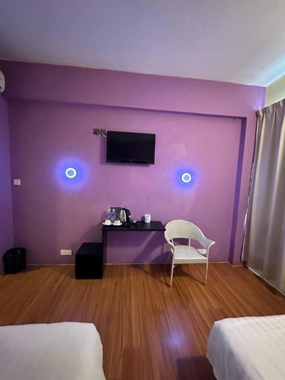 Postel nebo postele na pokoji v ubytování De Choice Hotel Tawau