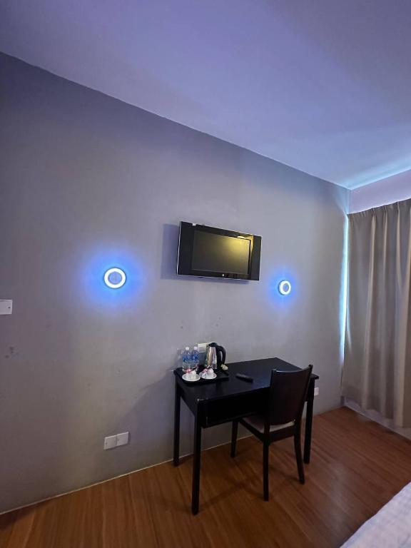 TV a/nebo společenská místnost v ubytování De Choice Hotel Tawau