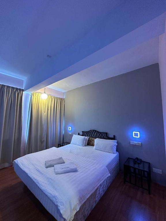 Postel nebo postele na pokoji v ubytování De Choice Hotel Tawau