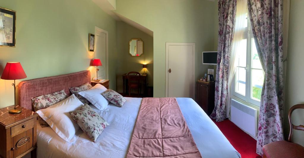 Postel nebo postele na pokoji v ubytování Château Maucaillou
