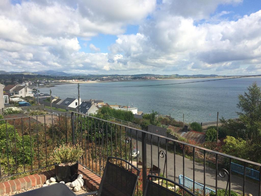 a view of the water from the balcony of a house at Stunning Sea view apartment absolute top quality 100s of 5 star reviews You will not be disappointed in Widows Row