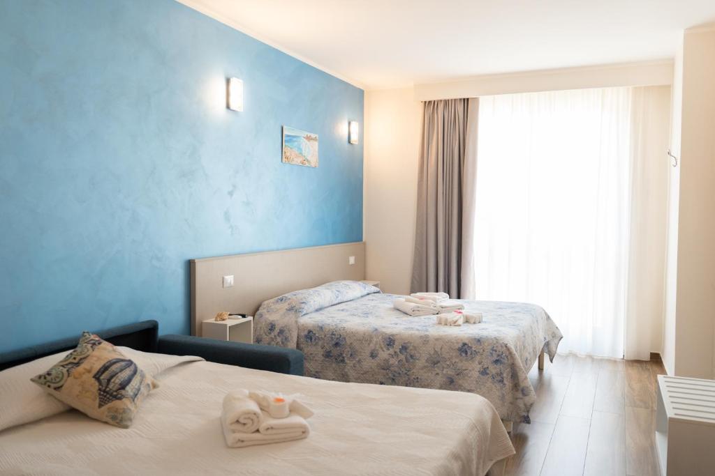 Postel nebo postele na pokoji v ubytování Asterias Residence - Rooms & SPA