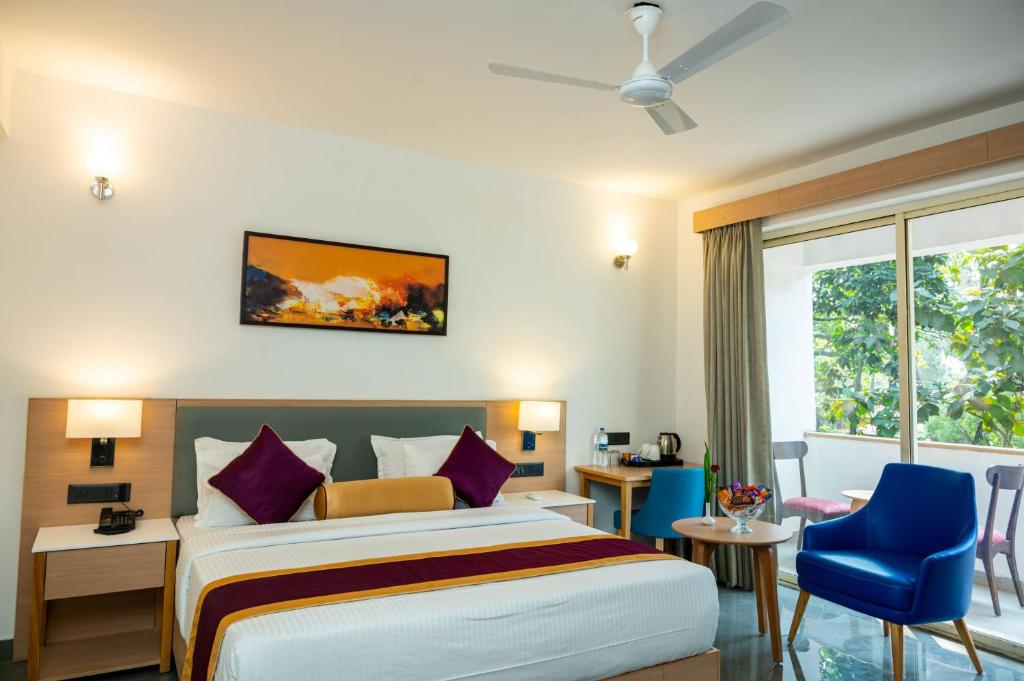 Postel nebo postele na pokoji v ubytování Hotel Meraden Opus , Anjuna Beach Goa