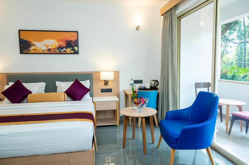 Postel nebo postele na pokoji v ubytování Hotel Meraden Opus , Anjuna Beach Goa