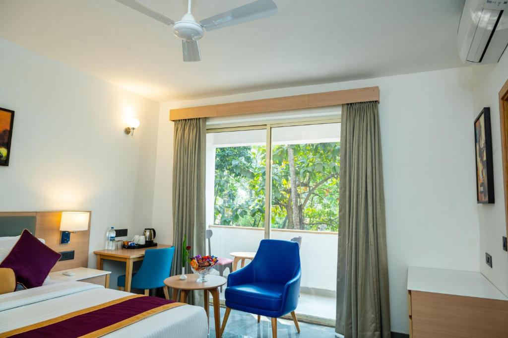 Postel nebo postele na pokoji v ubytování Hotel Meraden Opus , Anjuna Beach Goa