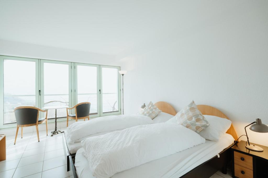 Letto o letti in una camera di Hotel Sonne