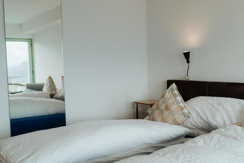Letto o letti in una camera di Hotel Sonne