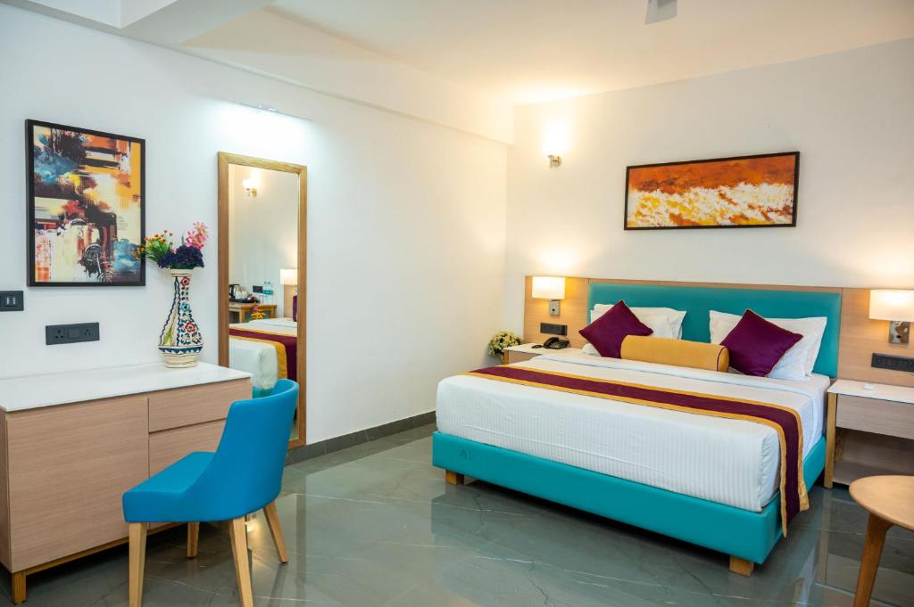 Postel nebo postele na pokoji v ubytování Hotel Meraden Opus , Anjuna Beach Goa