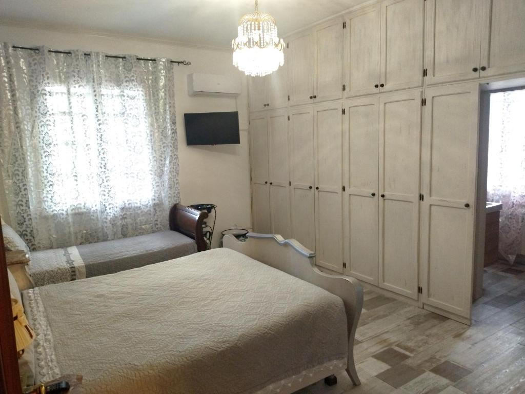 Posteľ alebo postele v izbe v ubytovaní VILLA MOLINELLA