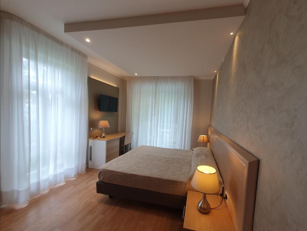 Postel nebo postele na pokoji v ubytování Hotel Eurovil Garni