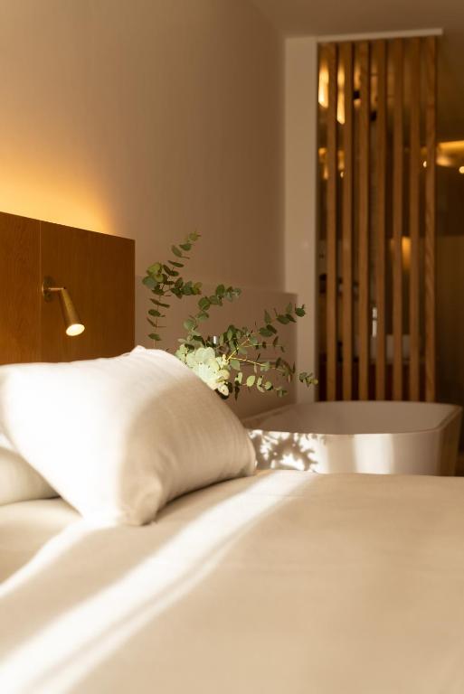 Postel nebo postele na pokoji v ubytování Nema Boutique Hotel & Spa