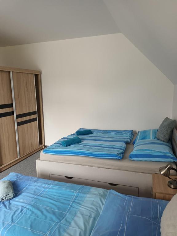 Postel nebo postele na pokoji v ubytování Vila Pavlínka apartmány Losiny